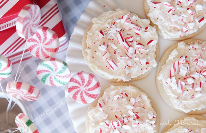 Candy Cane Cookies - sugar cookies topped with Peppermint Marshmallow Frosting and Candy Cane bits!