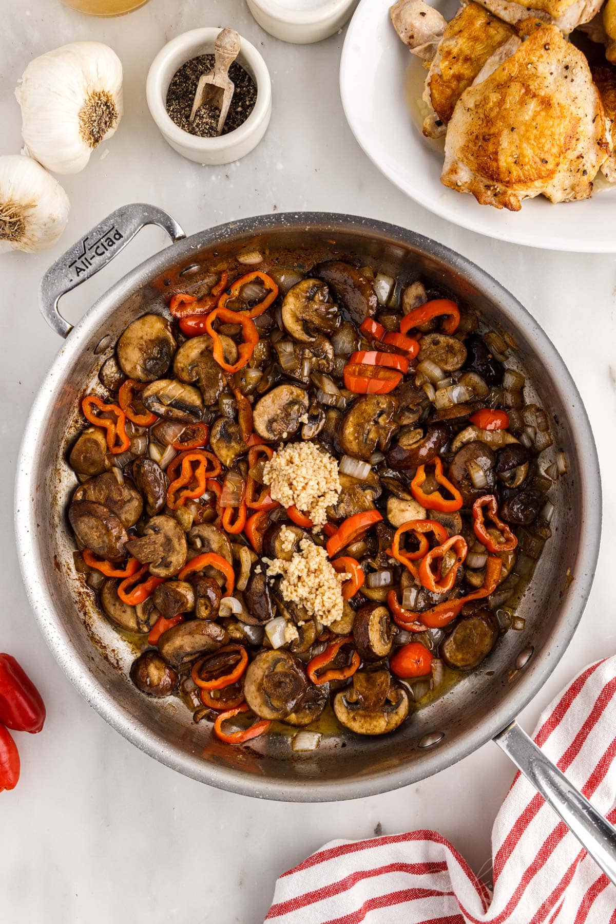 Garlic added to the skillet with the sauteed vegetables.