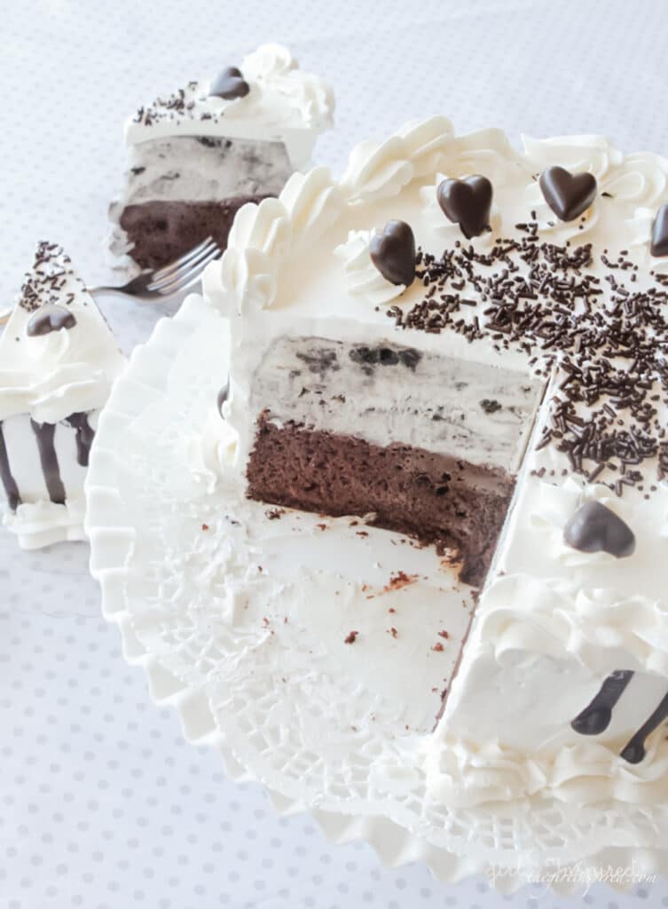 oreo ice cream cake with slice removed on white plate