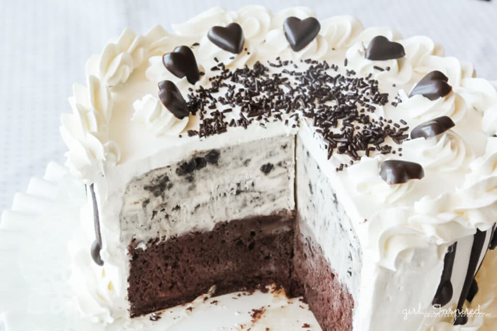 oreo ice cream cake with slice removed on white plate