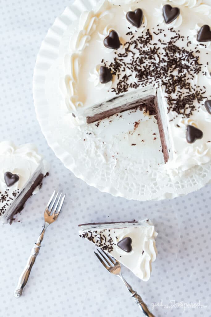 oreo ice cream cake with slice removed on white plate