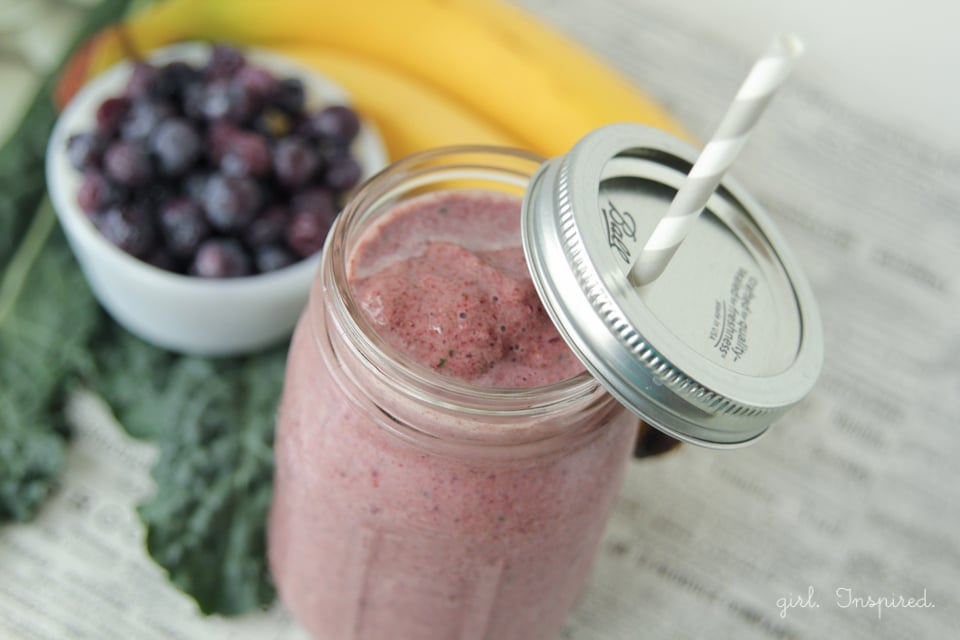 Blueberry Kale Smoothie in mason jar with straw