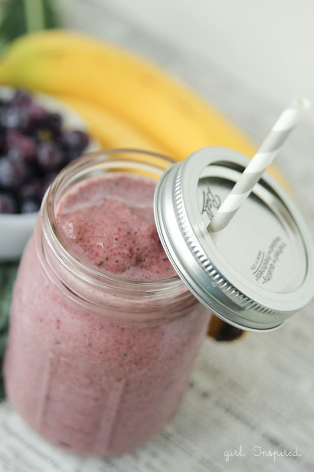 Blueberry Kale Smoothie in mason jar with straw