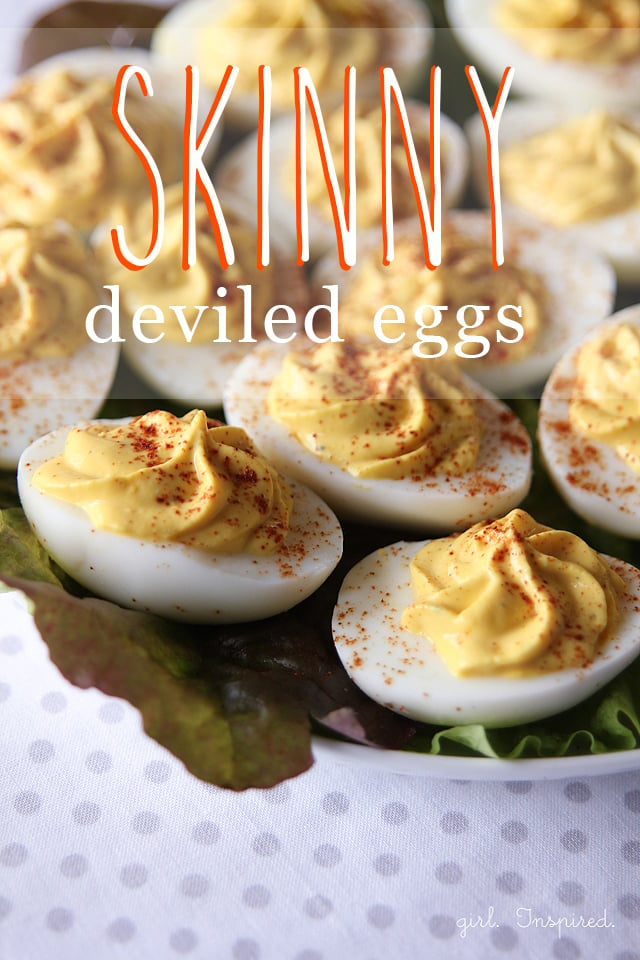 deviled eggs with swirled tops on a bed of lettuce with text overlay
