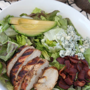 Delicious chicken chopped salad with recipes for grilled chicken and cilantro-lime dressing.