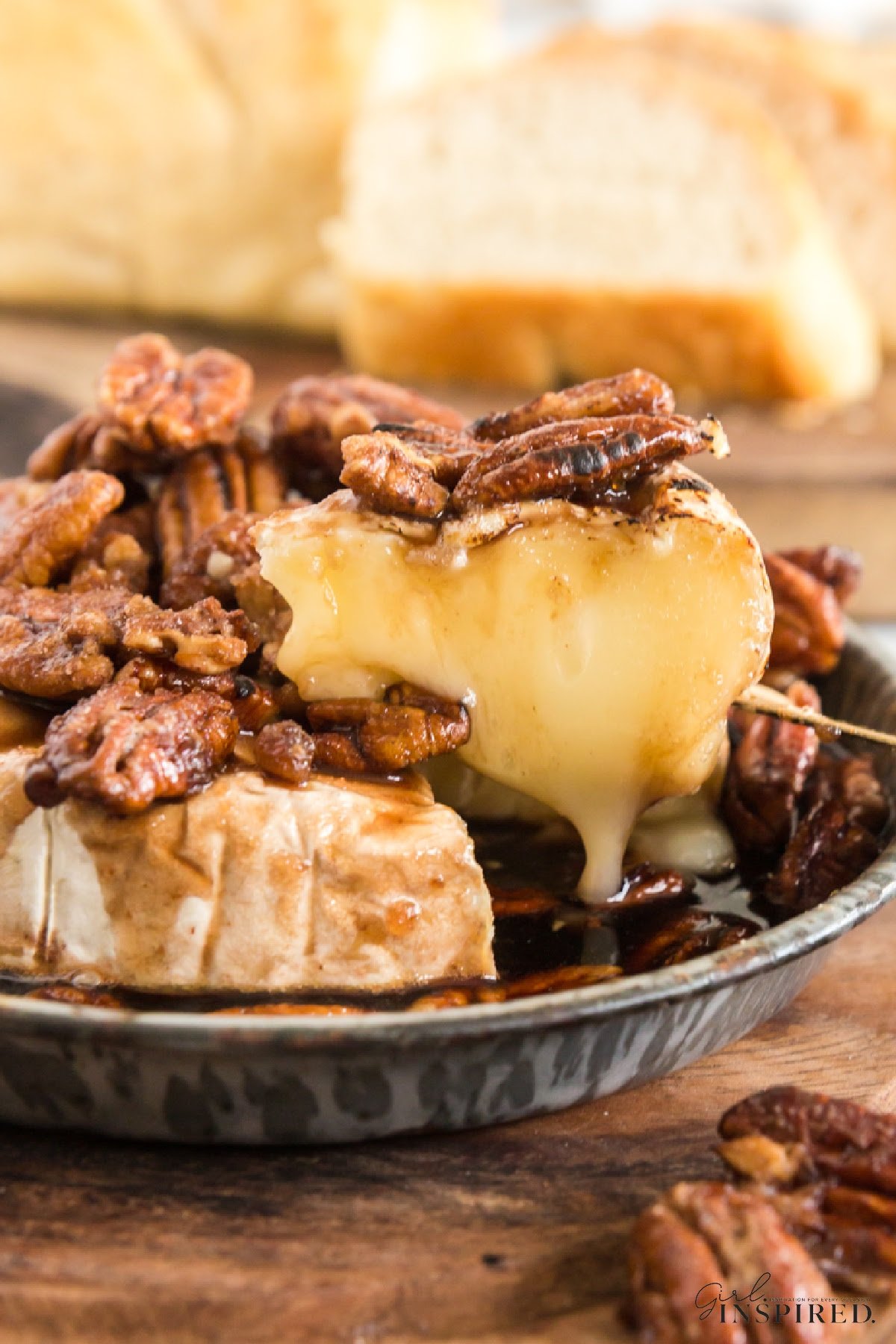 Warm brown sugar baked brie topped with pecans.