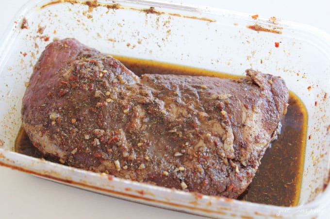 tri tip roast in marinade in glass baking dish