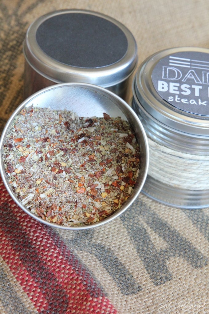 open container of spice rub showing herbs and spice mix