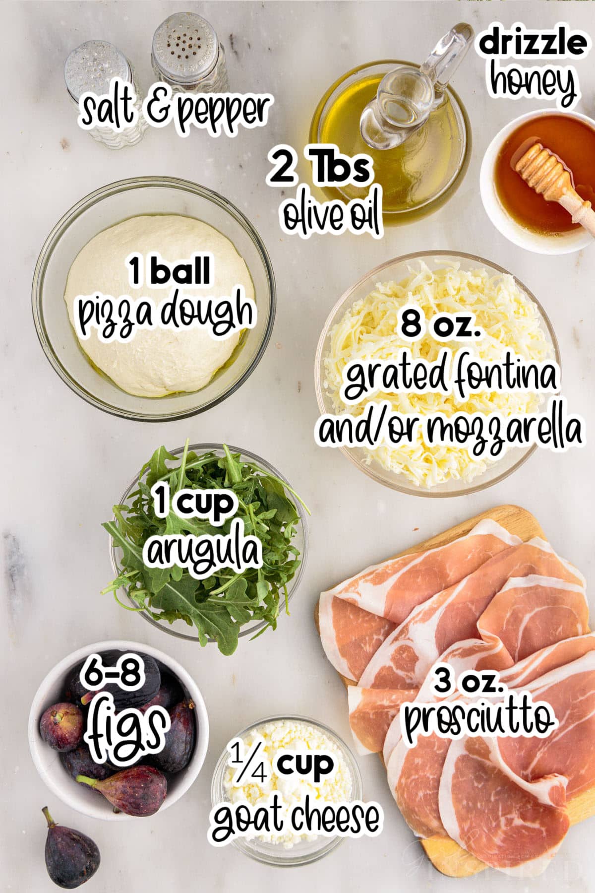 Individual ingredients set out in bowls and plates for fig prosciutto pizza, with text labels.