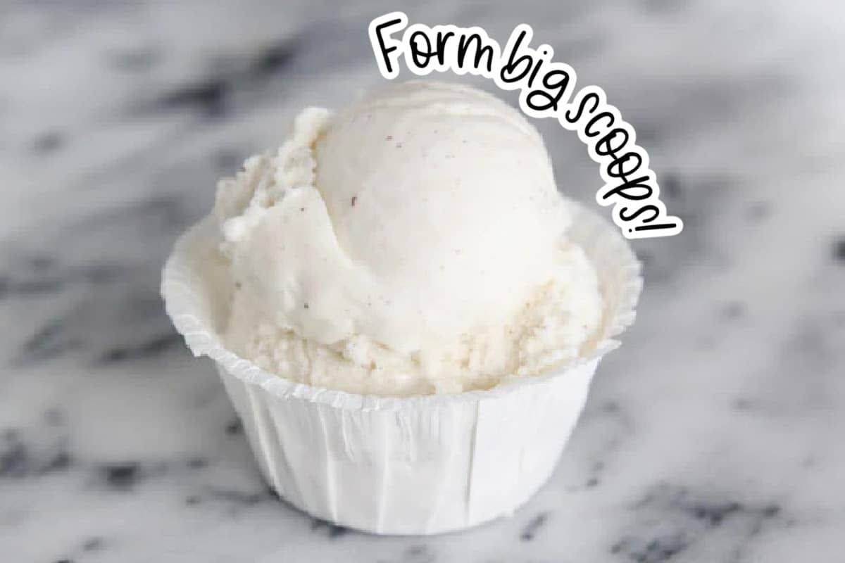 A scoop of vanilla ice cream in a paper cup with text "form big scoops!"