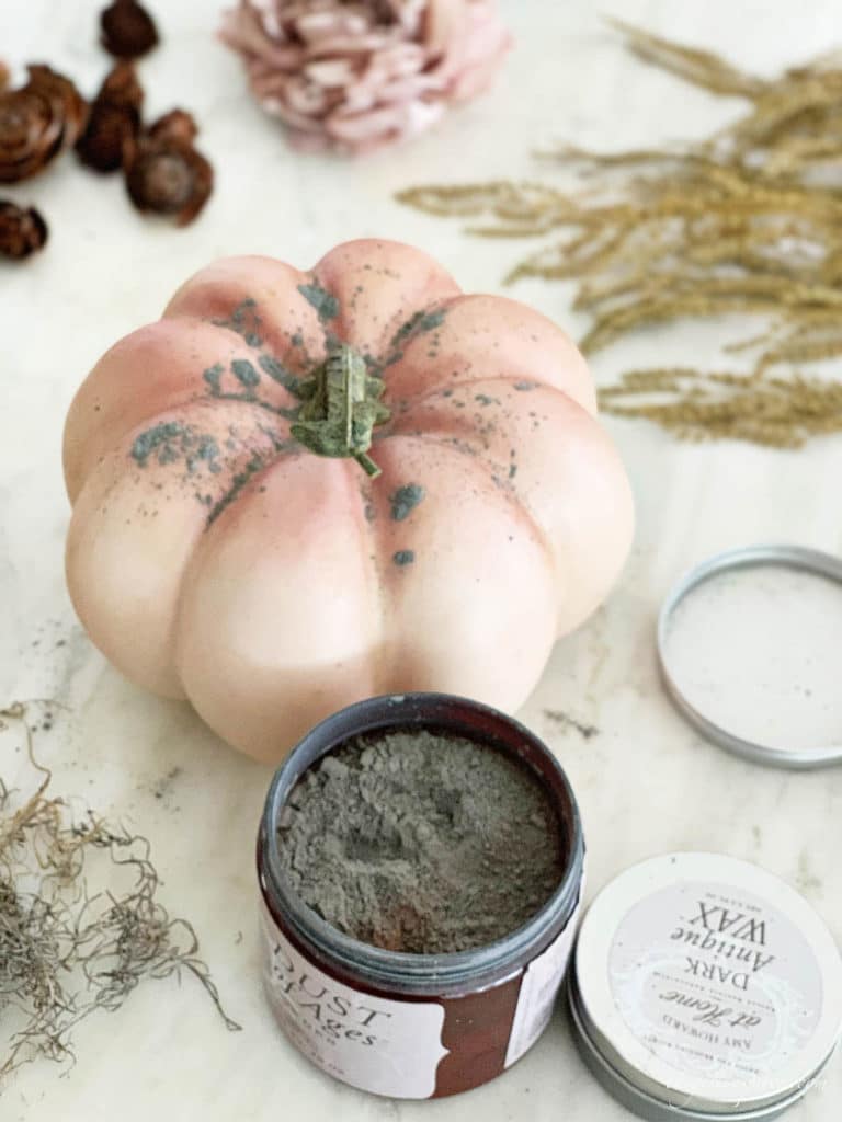 Use Antiqueing wax and dust of ages to give plastic craft pumpkins a weathered look