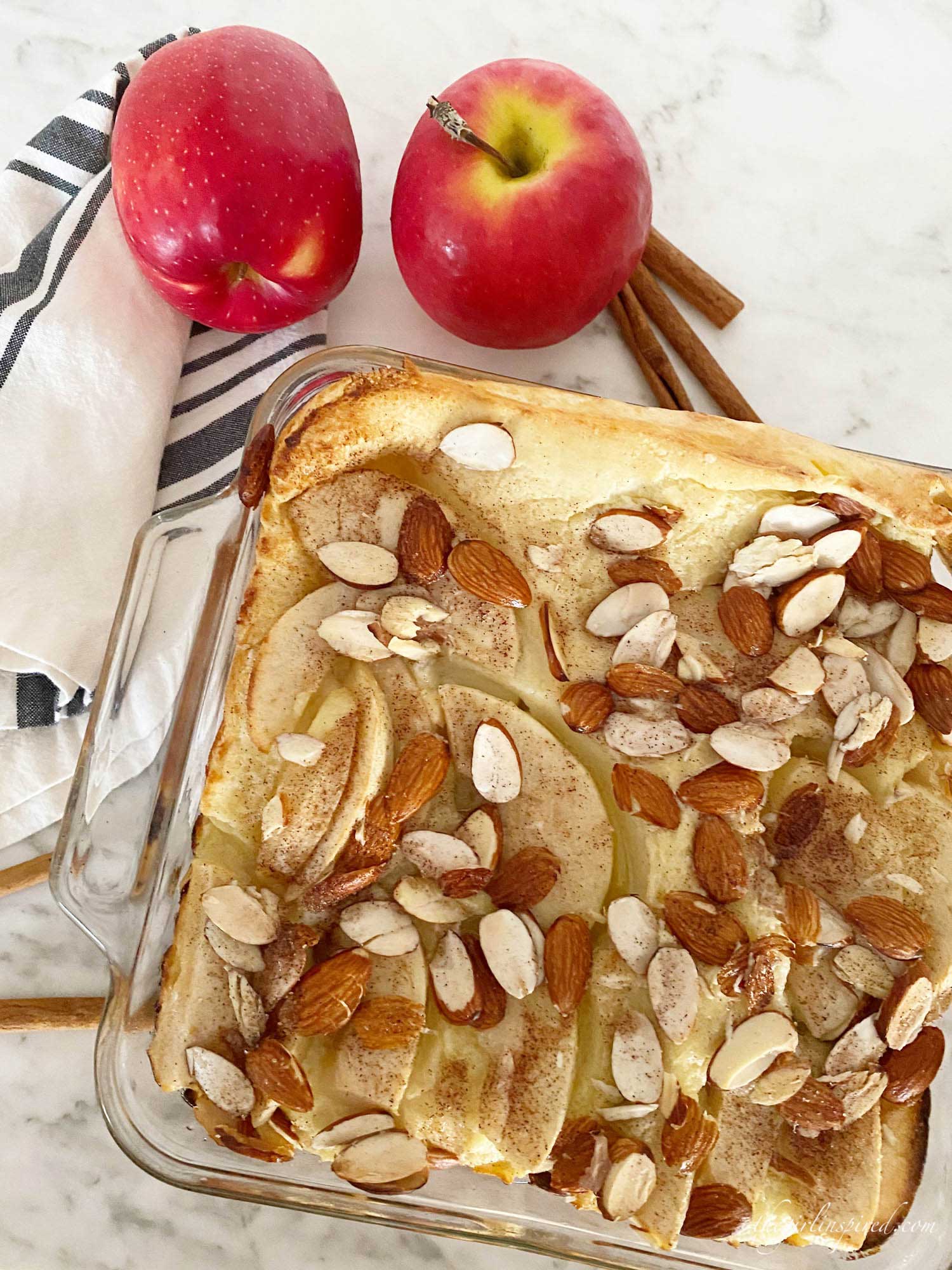 German pancake with red apples, sliced almonds