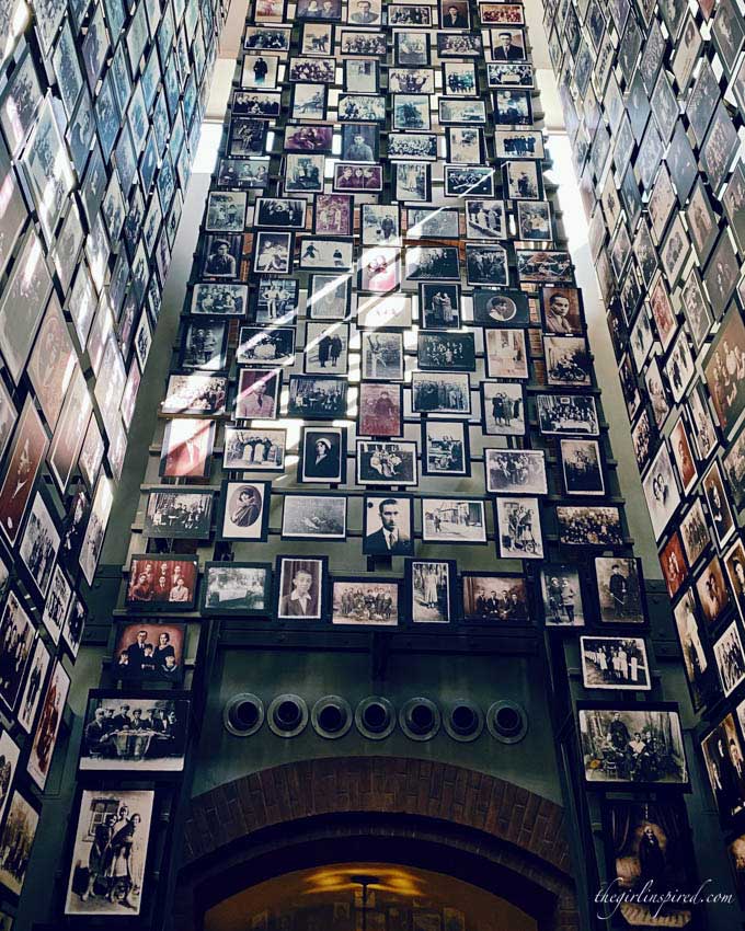 Upward view of hallway filled with photographs