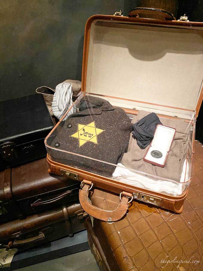 small suitcase with clothing and yellow star, sitting on table