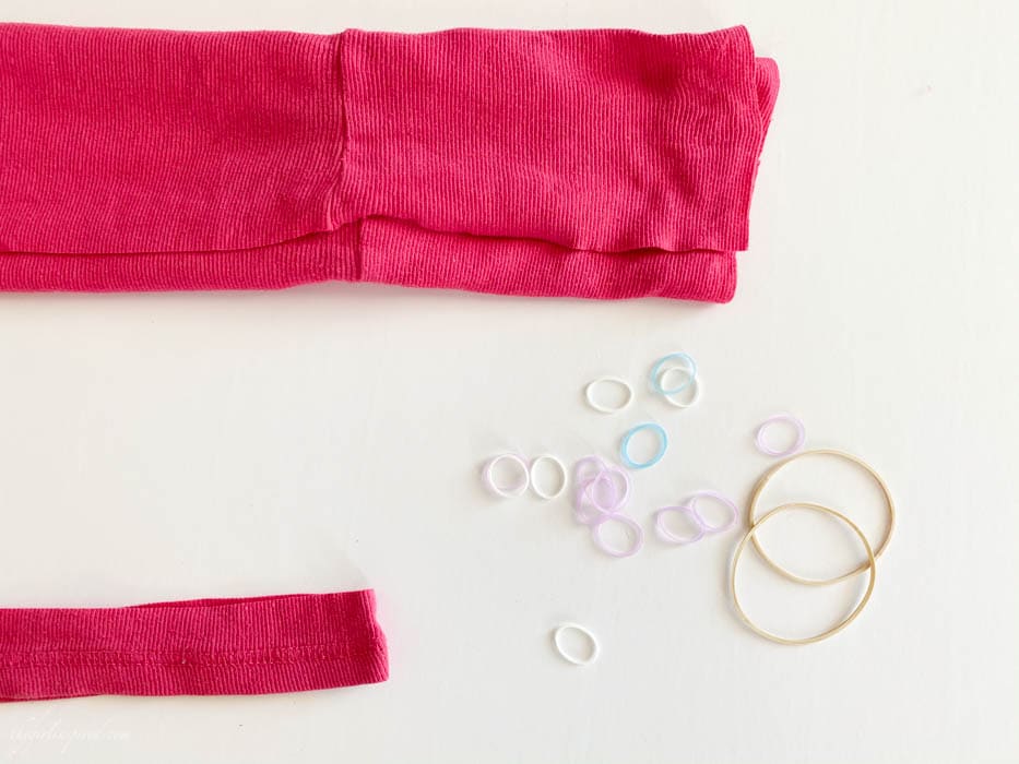 rubber bands, loom bands and folded pink fabric