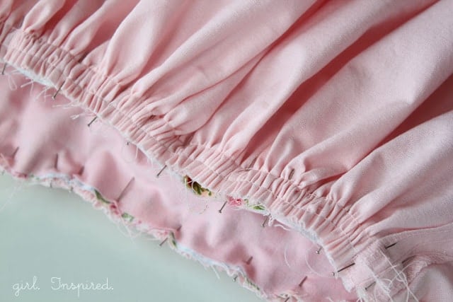 pink fabric gathered and pinned