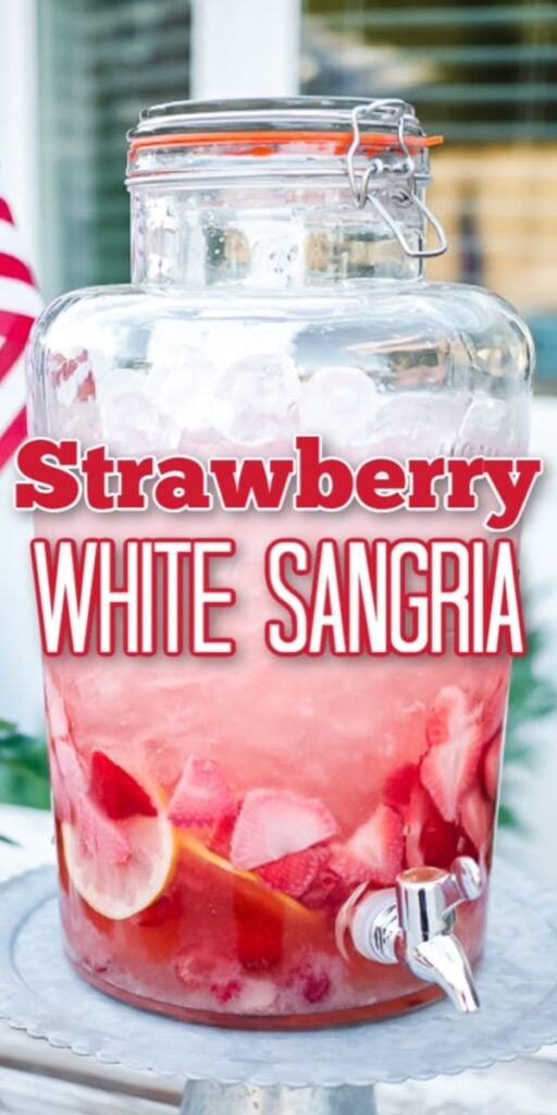 strawberry sangria in large glass drink dispenser on pedestal stand, lemon wedges and fresh berries in wine glasses on table and American flag in the background with text overlay