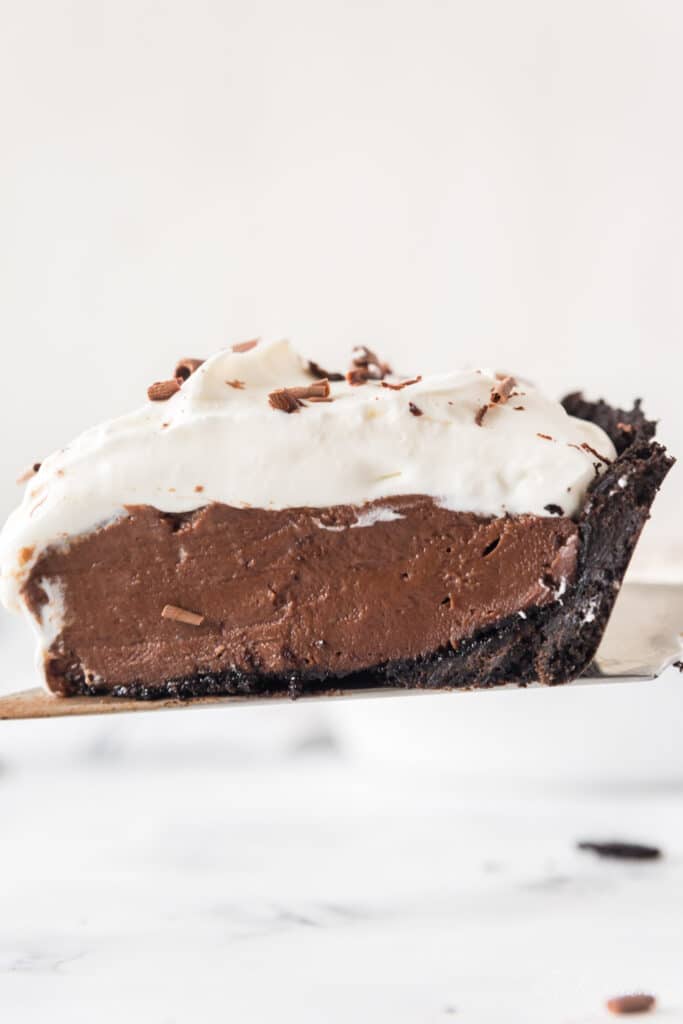 slice of chocolate cream pie on serving spatula