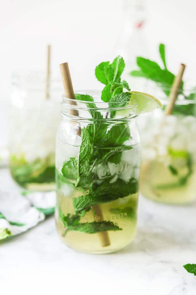 classic rum mojito with mint and lime in mason jars