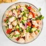 Overhead of shrimp ceviche in glass bowl.