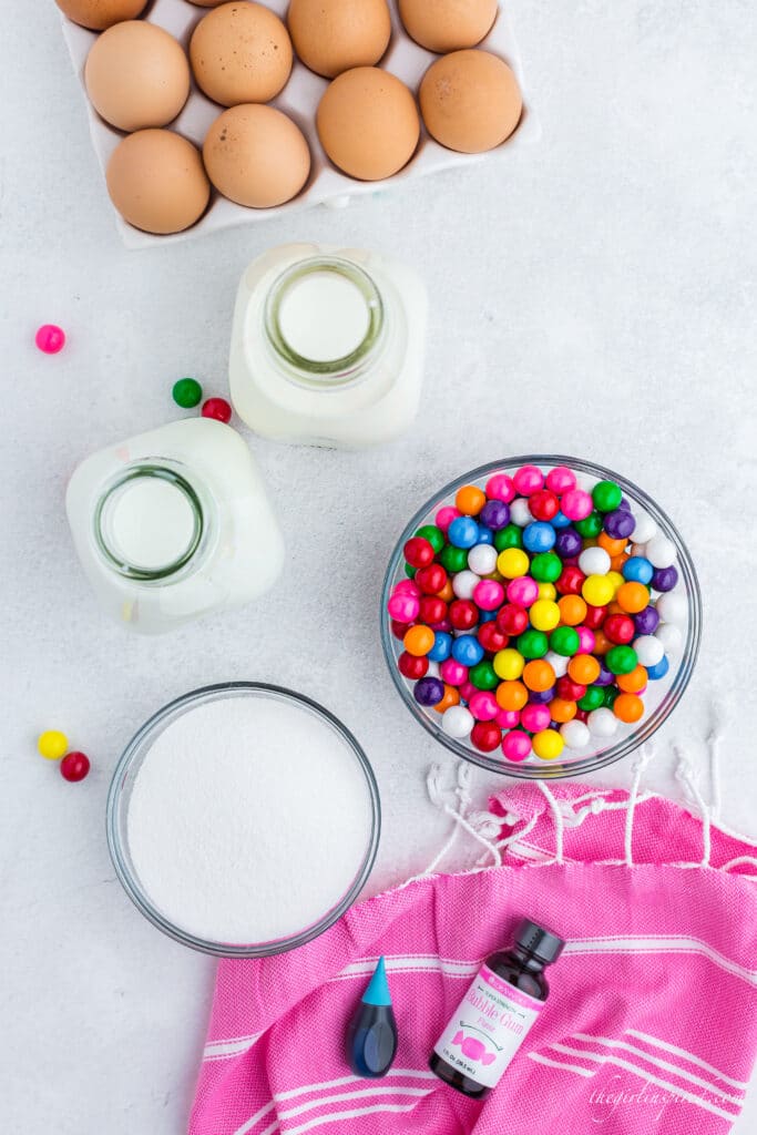 ingredients for ice cream - eggs, milk, cream, sugar, food coloring, flavoring, bubblegum balls