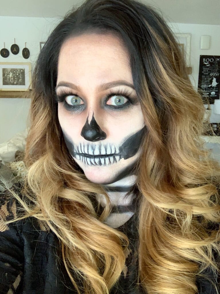 close up photo of woman with skeleton face makeup