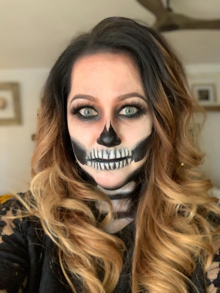 close up photo of woman with skeleton face makeup