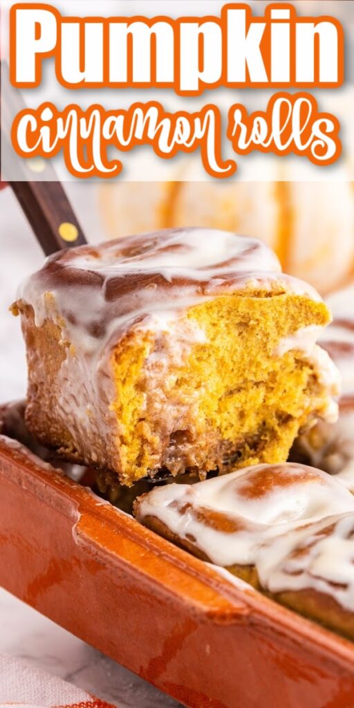 pumpkin cinnamon roll being scooped out of baking dish with pumpkins in the background