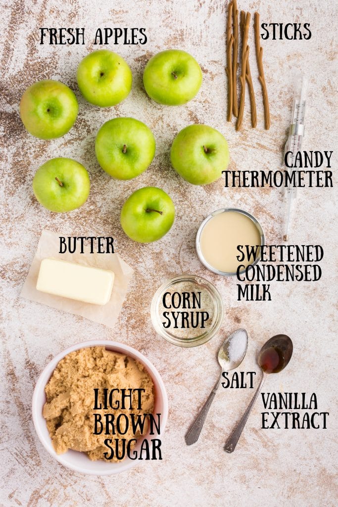 ingredients for caramel apples with text overlay: green apples, butter, brown sugar, vanilla, salt, sweetened condensed milk, sticks and candy thermometer