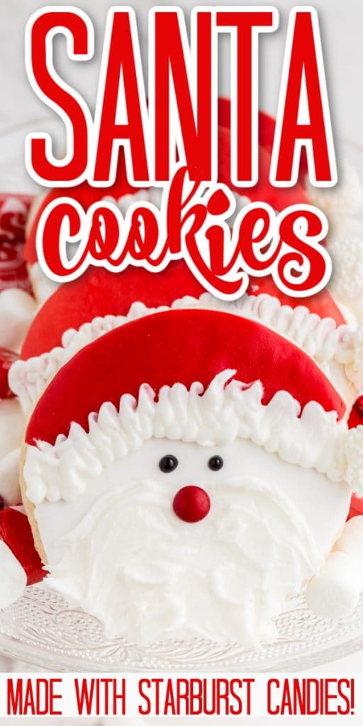 cookies decorated with candy santa face stacked on glass plate