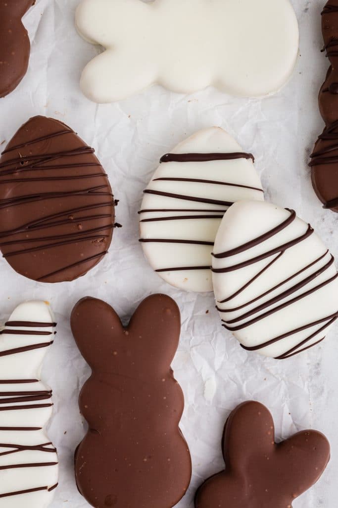 white and milk chocolate bunny and egg shapes with dark chocolate drizzle over the top
