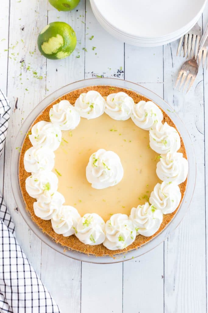 key lime pie with whipped cream piped on top