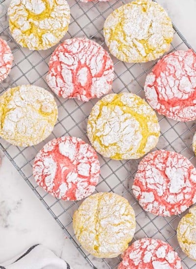 overhead of pink and yellow crinkle cookies on cookie sheet