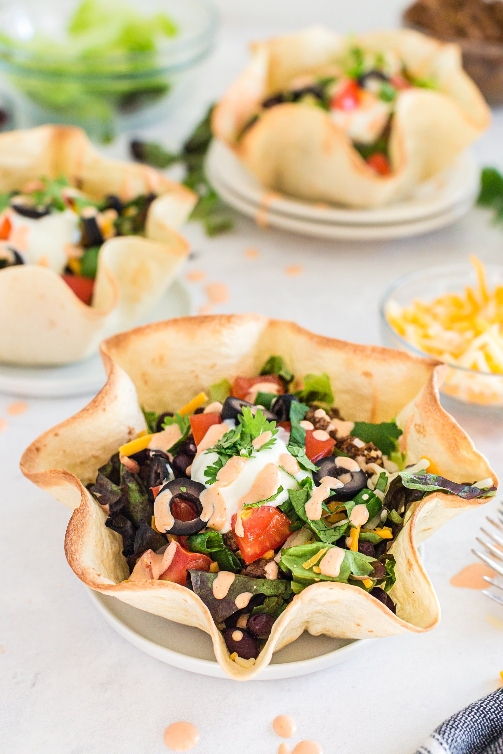 taco salad prepared in a bowl made from a flour tortilla