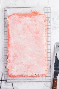 glaze spread over strawberry brownies