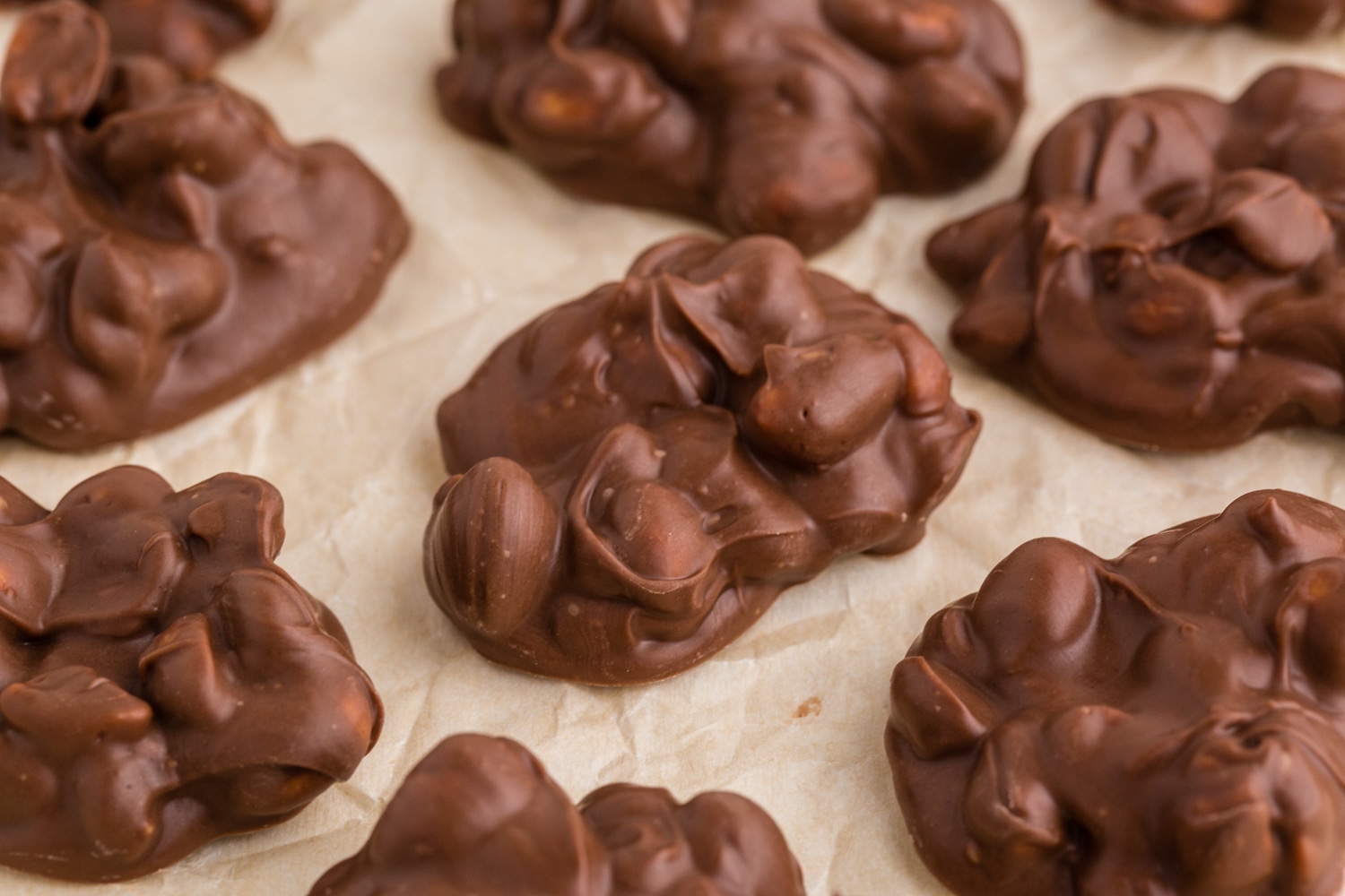 Chocolate Peanut Butter Clusters on parchment paper.