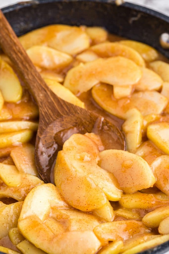 Close up Fried Apples with wooden spoon
