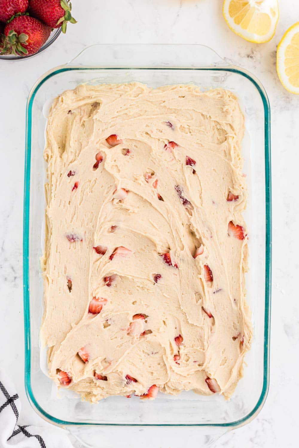 Spread out Strawberry Blondie batter in glass pie dish