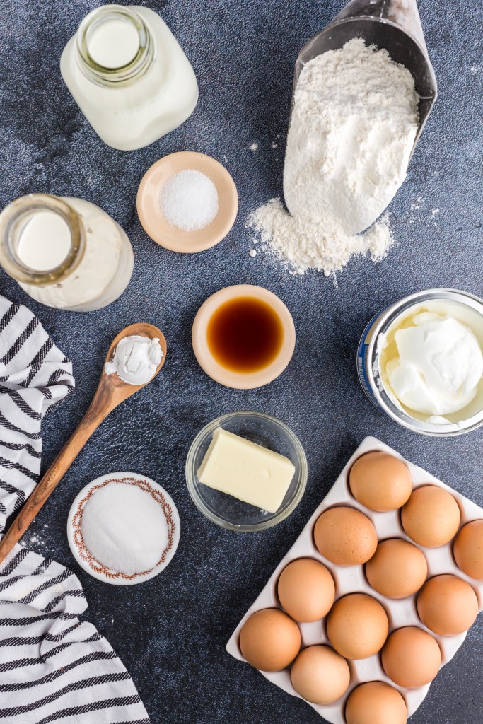 individual ingredients for funnel cakes - flour, eggs, butter, milk, vanilla, etc.