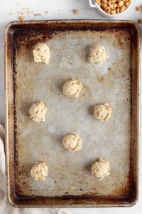 butterscotch cookie dough balls on a baking sheet
