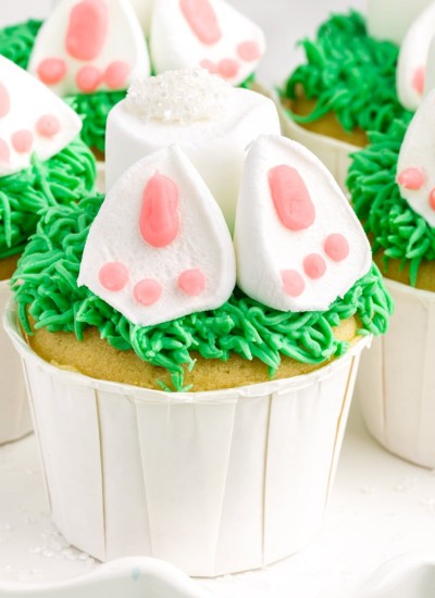 cupcakes with green grass and marshmallows with pink icing for bunny butt and feet