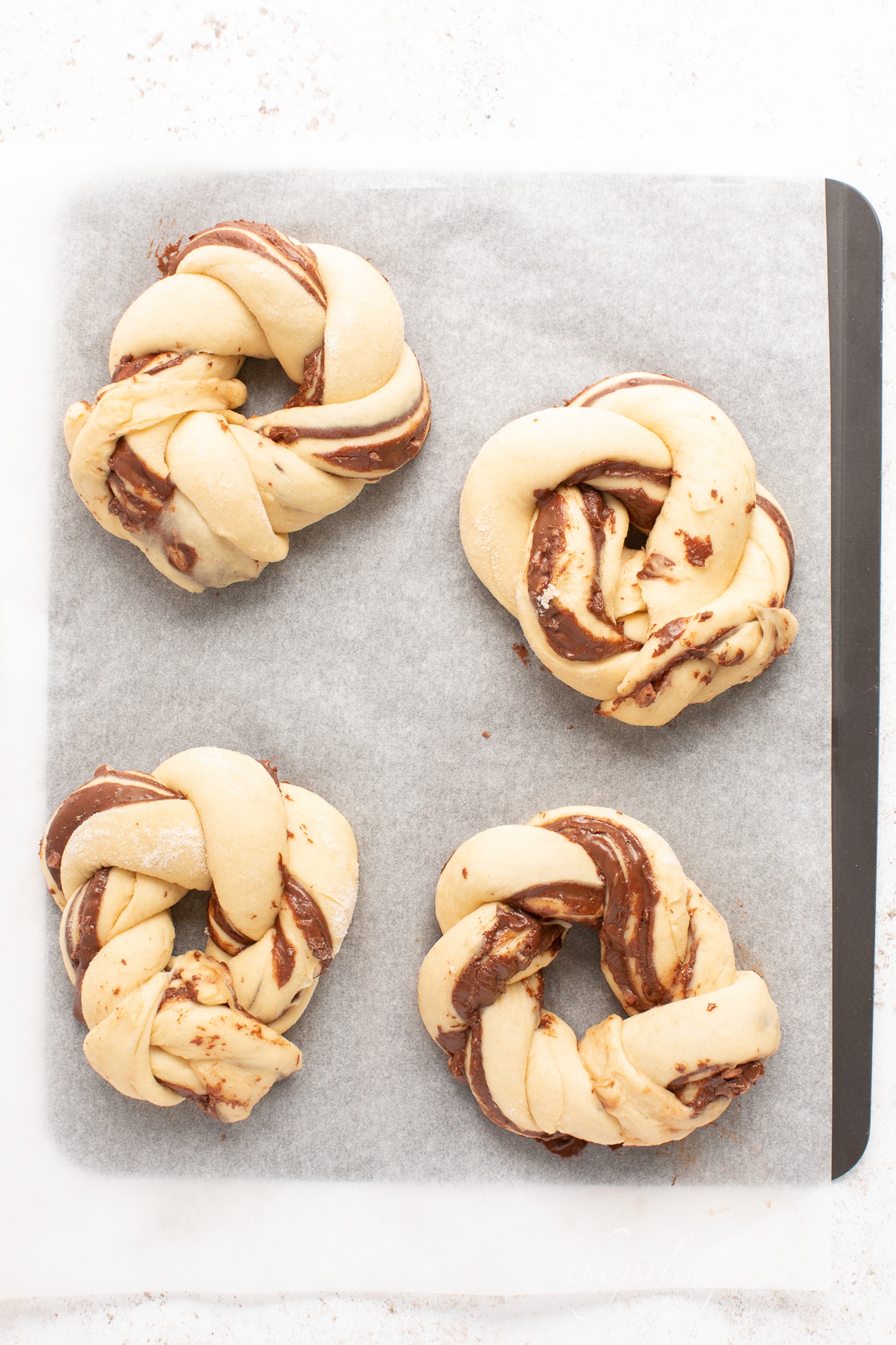 twisted babka rolls on baking sheet