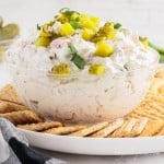 dip in bowl on white plate with crackers