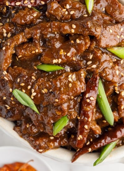 top view of mongolian beef in a white serving dish