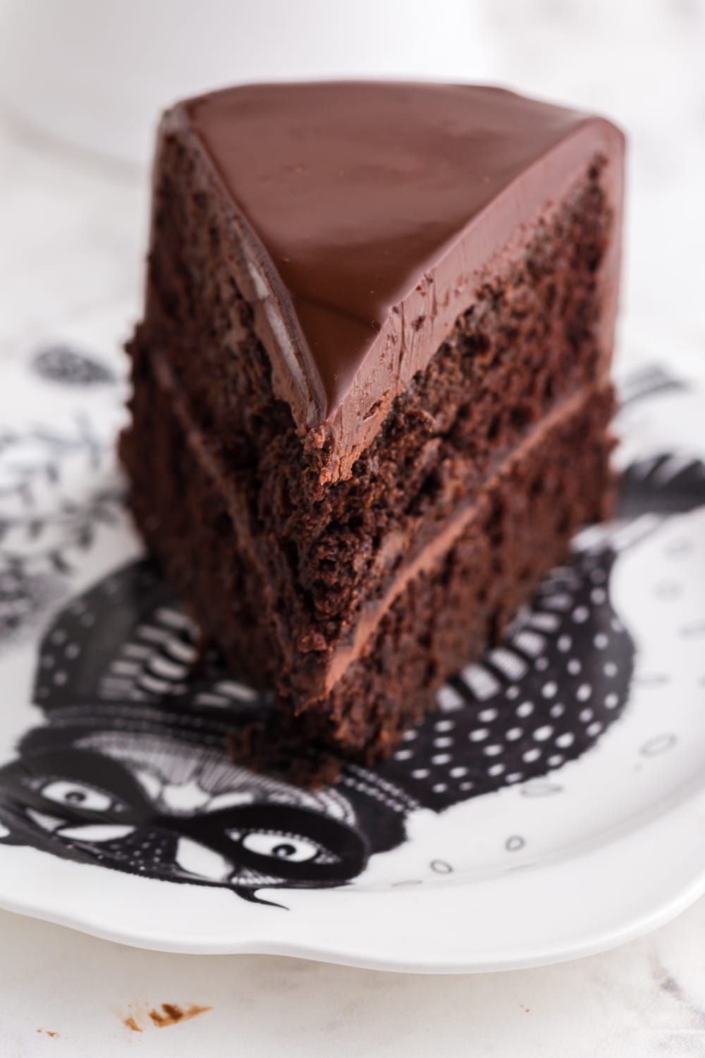 Slice of black magic cake on a dessert plate.