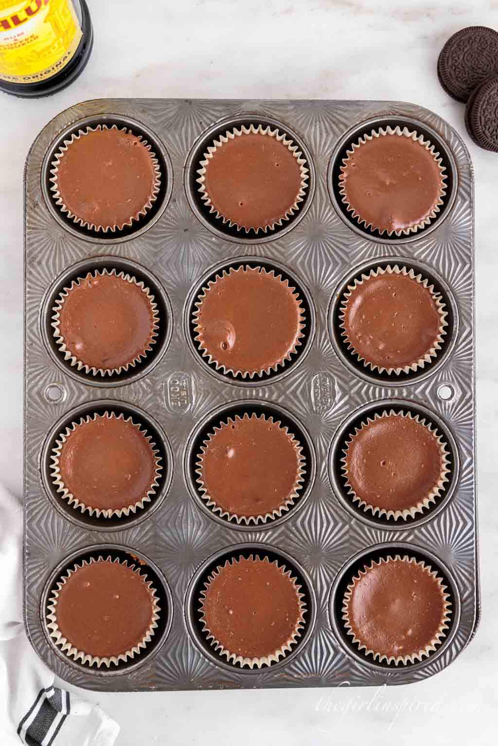 baked Kahlua cheesecake bites in muffin tin.