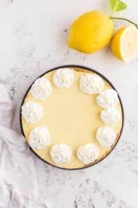 set cheesecake with added dollops of whipped cream