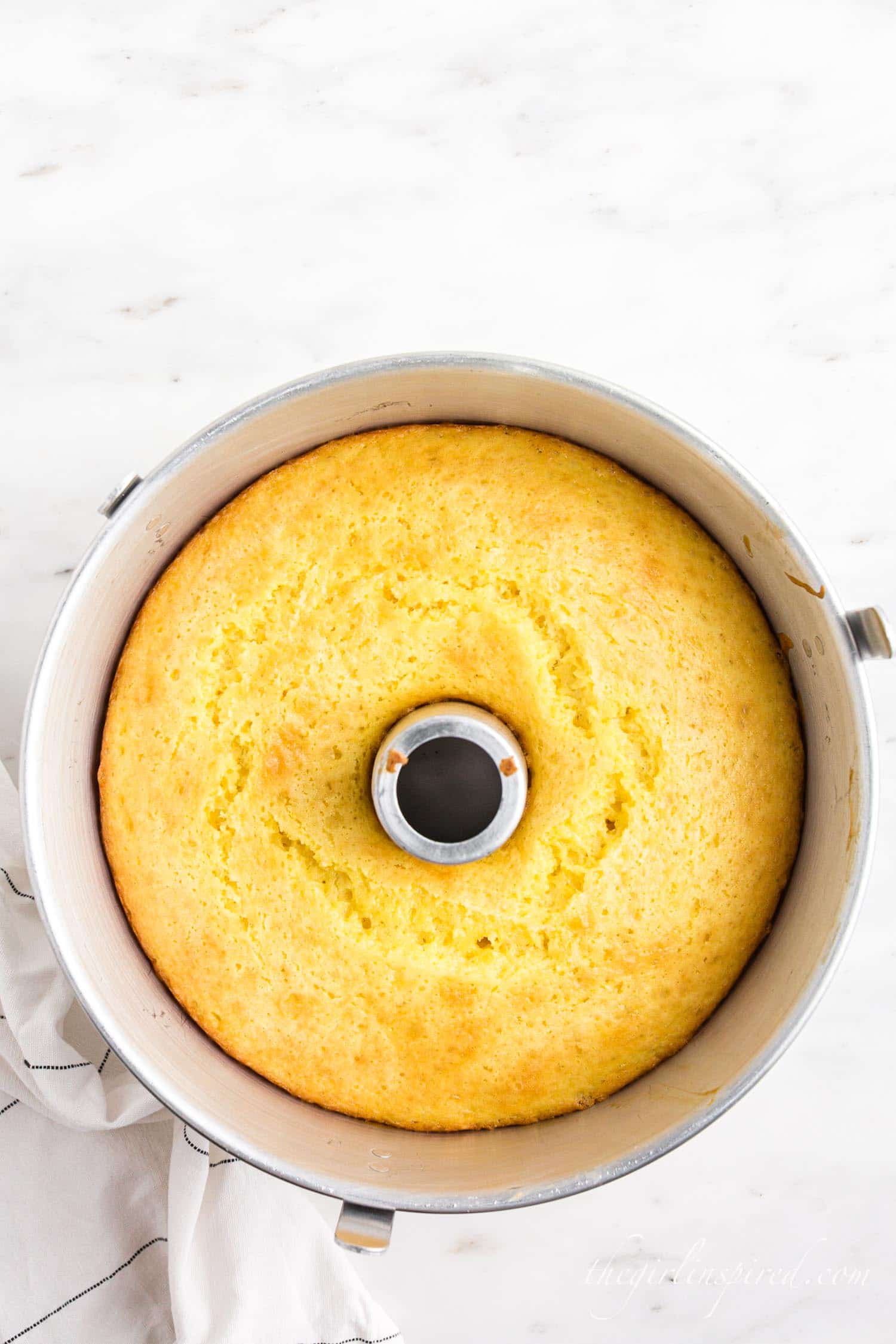 baked lemon chiffon cake in bundt pan.