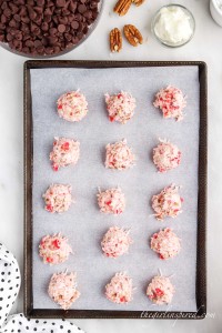 rows of martha washington candy balls on cookie sheet prior to coating in chocolate.
