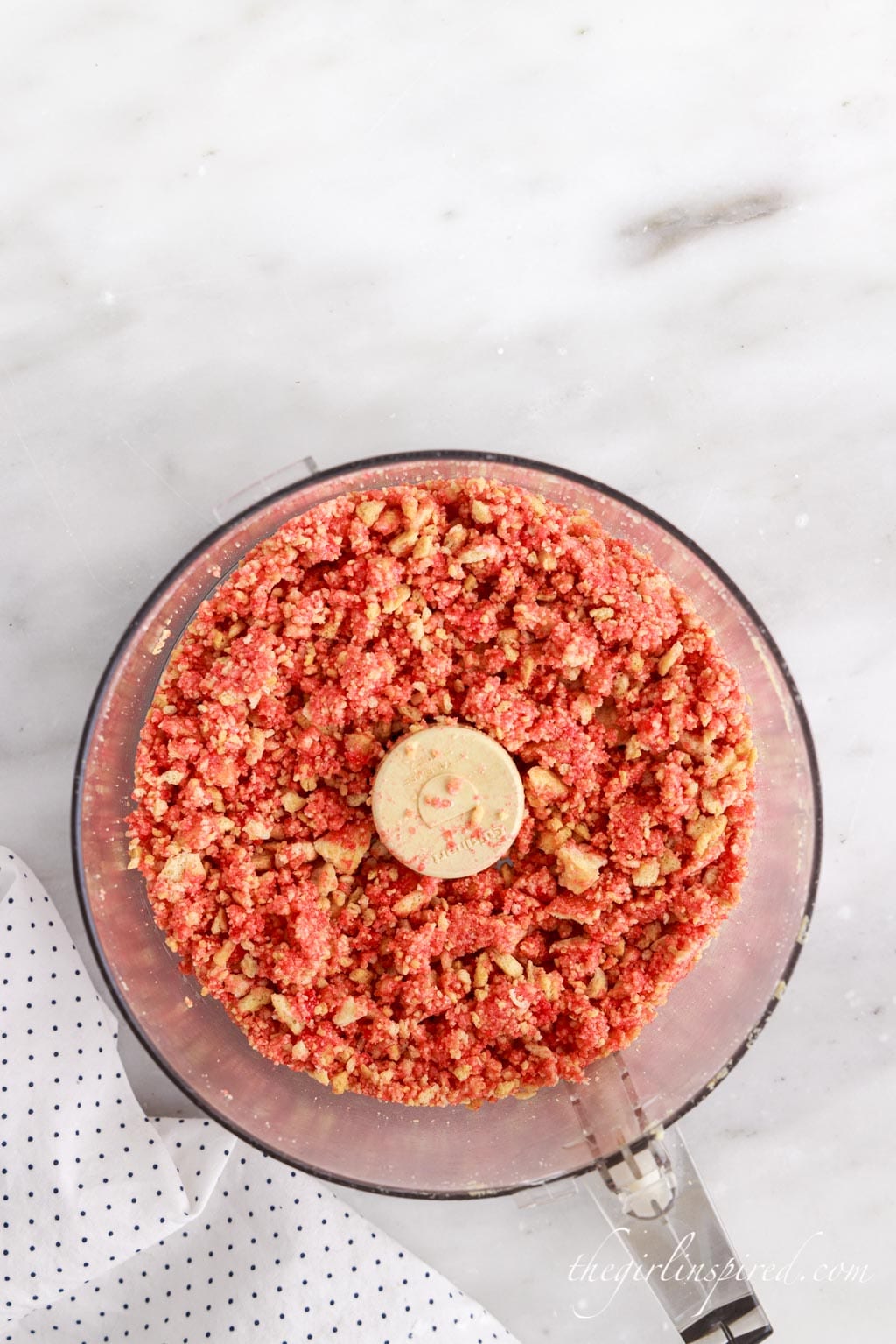 mixing strawberry crunch topping ingredients in food processor
